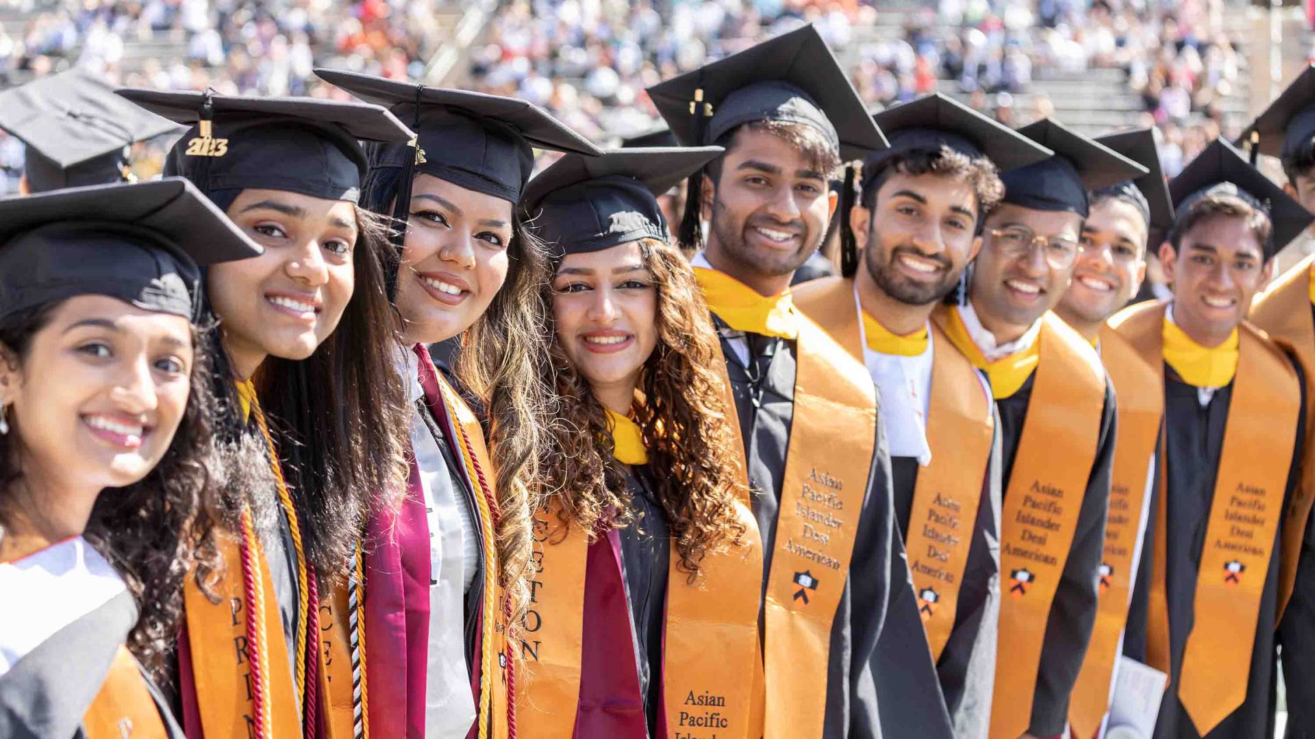 Graduating students smiling