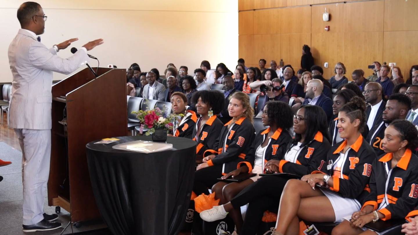 Professor Glaude speaking to seniors