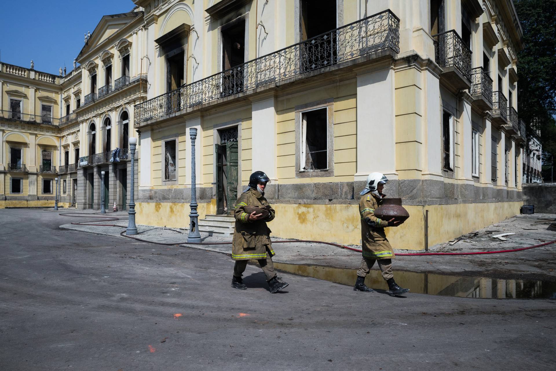Firefighters carry out artifacts