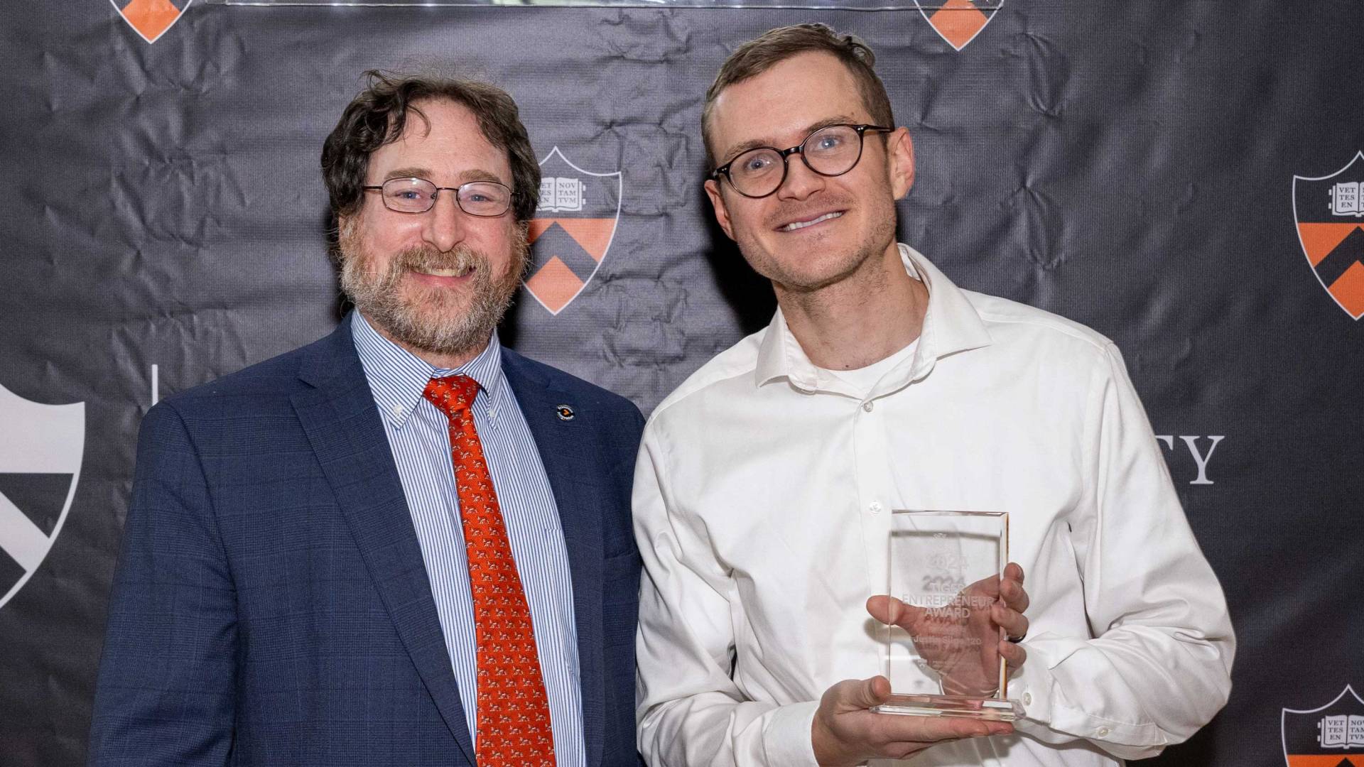 Arnold and Silpe pose with his Tiger Entrepreneur trophy